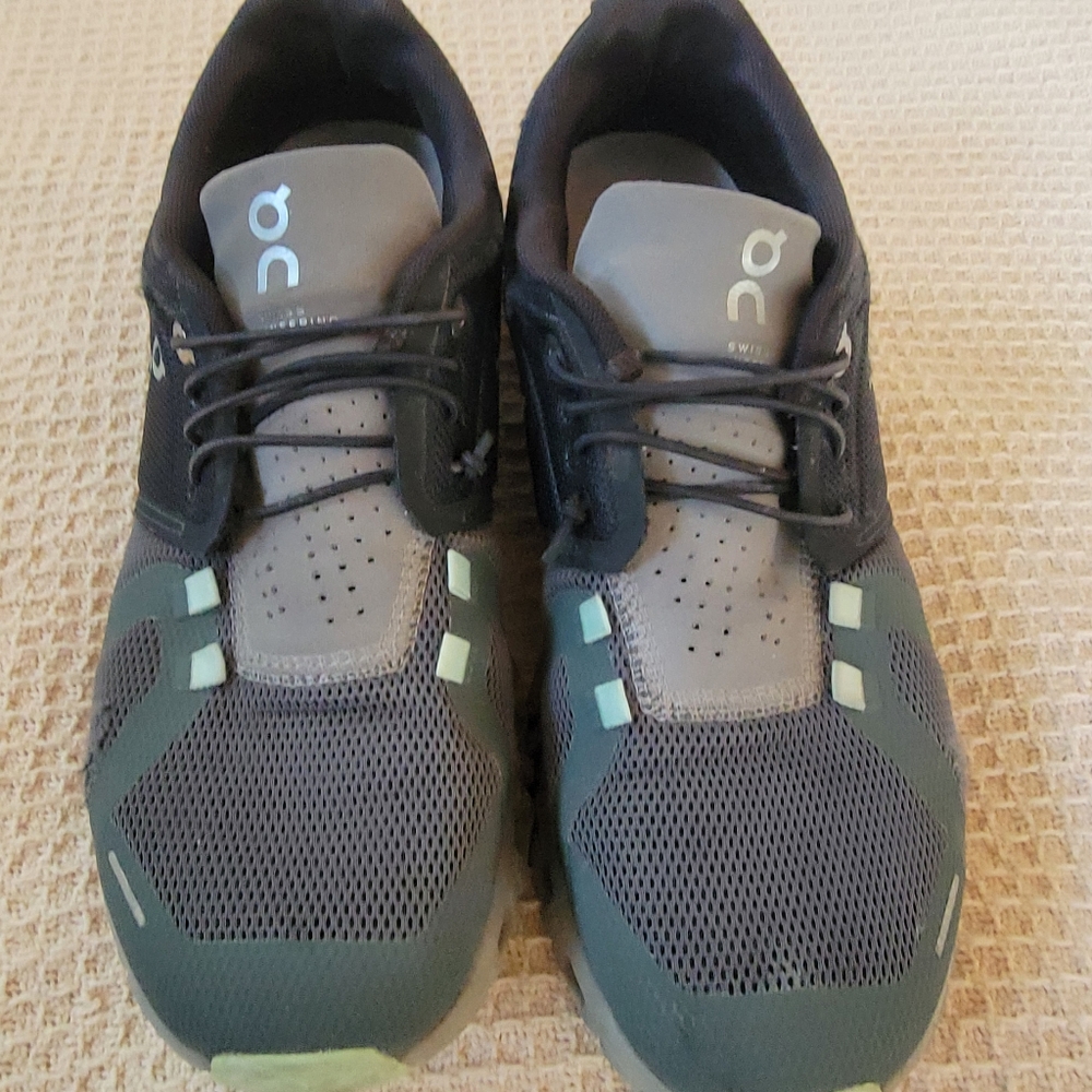On Running Black and Green Athletic Shoes with CloudTec Sole